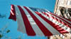 Photo of tattered flag hanging in New York City shortly after 9-11.